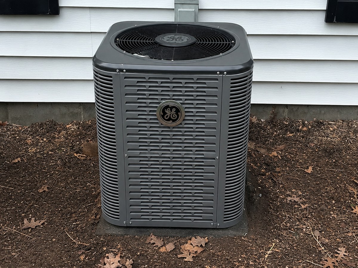 New GE condenser installed on a level pad