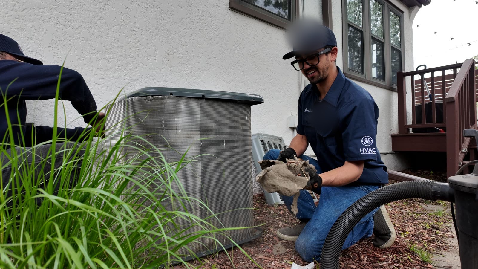 Condenser coil vacuum and deep-clean during a Super Clean tune-up