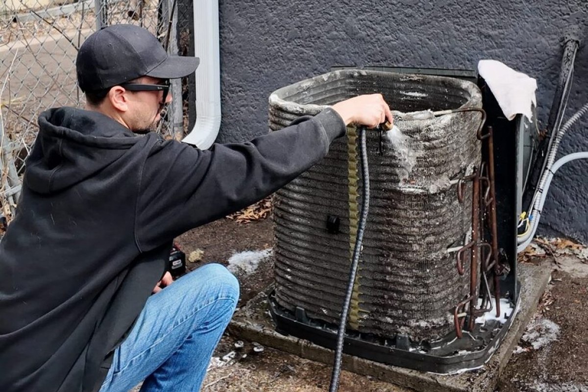 Condenser coils washed down with a hose during a Super Clean