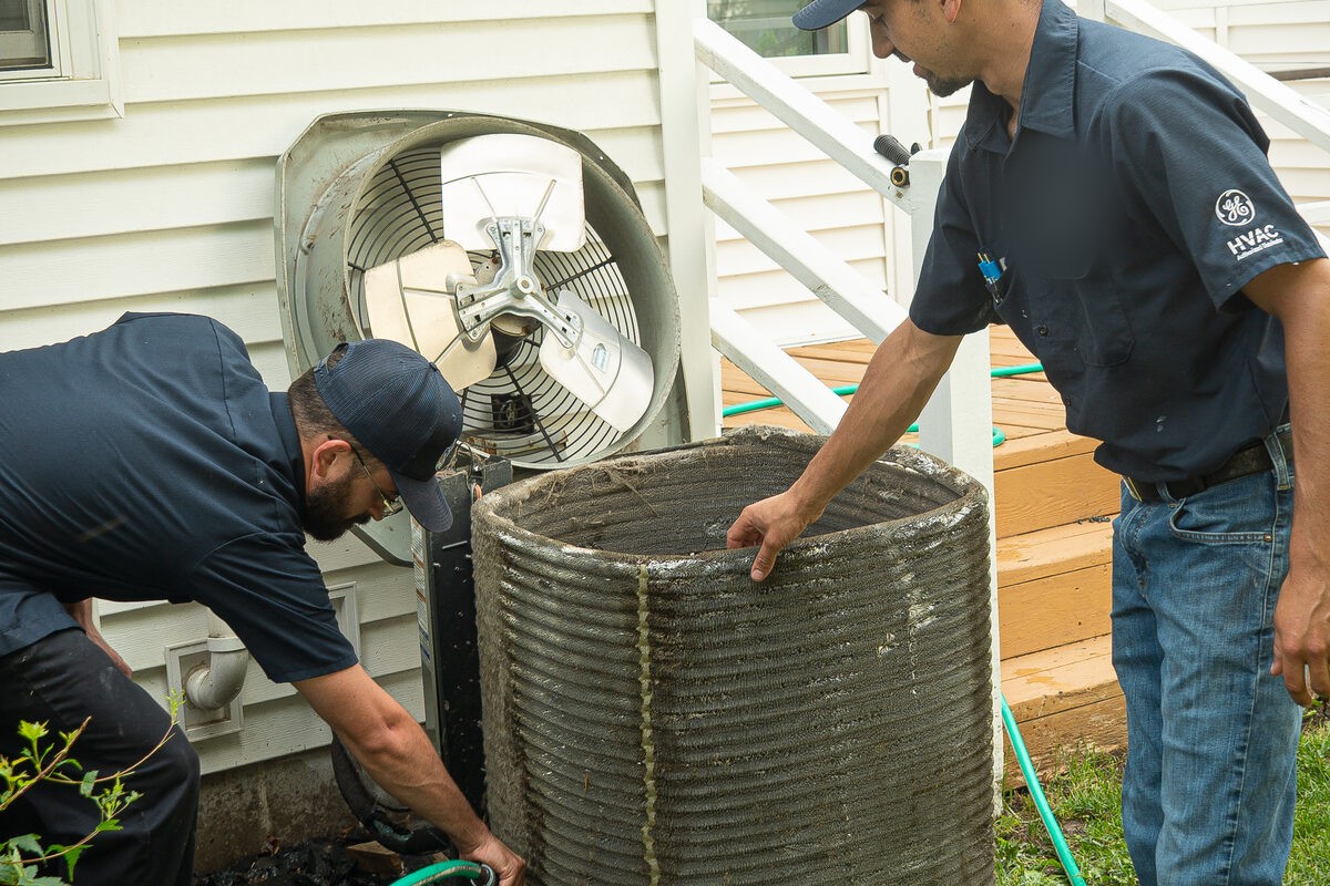 Condenser coils washed down with a hose during a Super Clean