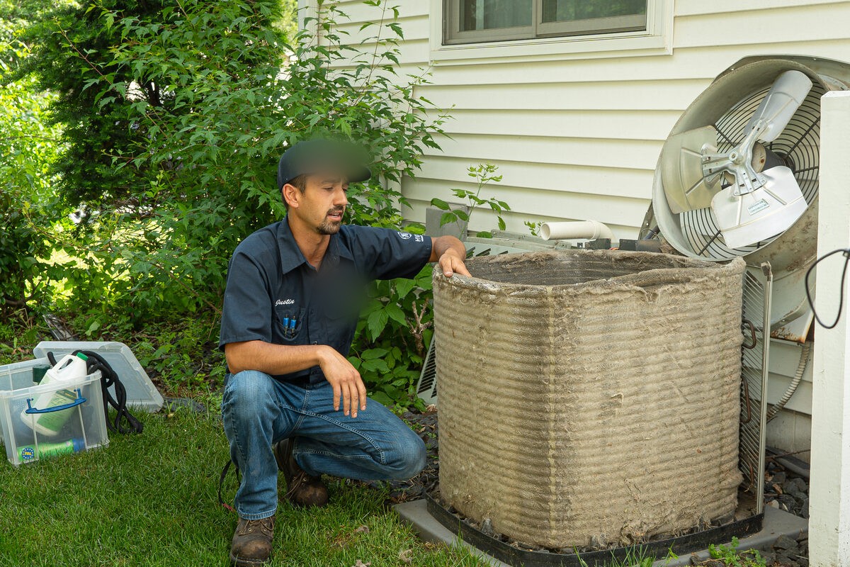 Justin performing a Super Clean tune-up at a Twin Cities home